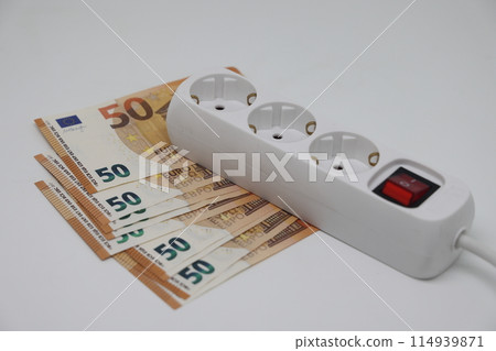 White electric cable and banknotes, expensive electricity, saving electricity. White electric cable and banknotes, expensive electricity, saving electricity. 114939871