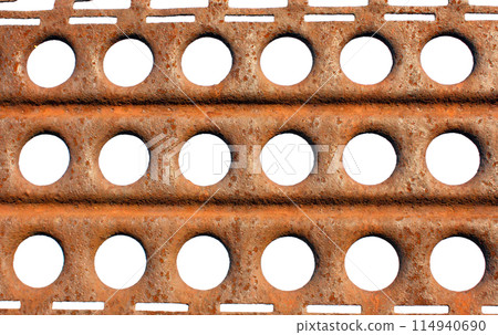 Rusty metal plate with cut out holes isolated on white background 114940690
