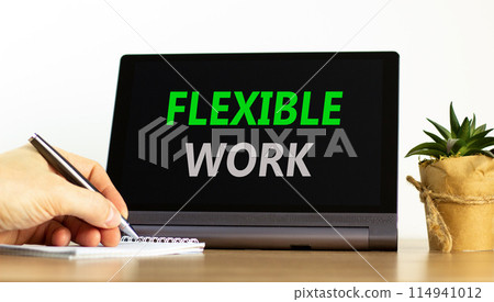 Flexible work symbol. Concept words Flexible work on beautiful black pad. Beautiful white background. Businessman hand. Business Flexible work concept. Copy space. 114941012