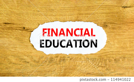 Financial education symbol. Concept words Financial education on beautiful white paper. Beautiful wooden wall background. Business Financial education concept. Copy space. 114941022