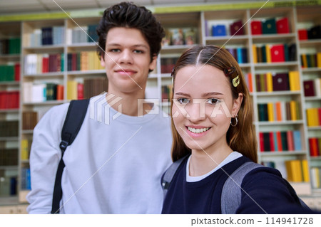 Selfie portrait of friends teenagers high school students looking at camera inside classroom Selfie portrait of friends teenagers high school students looking at camera inside classroom 114941728