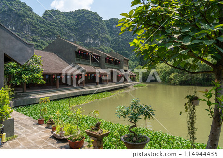 Hanoi, Vietnam: The courtyard of a restaurant in Ninh Binh that makes use of the valley topography 114944435