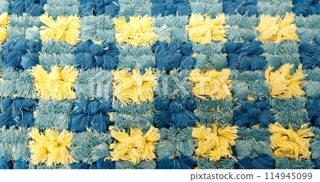 Blue and yellow fabric checkered background 114945099