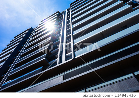 Newly built apartment building bathed in sunlight - high contrast Newly built apartment building bathed in sunlight - high contrast 114945430