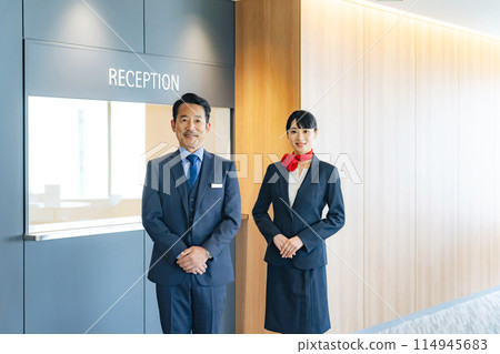 Employee at the reception Employee at the reception 114945683