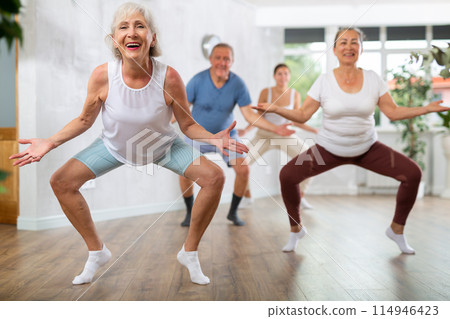 Group of people of different ages dancing in studio Group of people of different ages dancing in studio 114946423