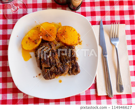 Roasted beef in chimichurri sauce with potatoes al Caliu Roasted beef in chimichurri sauce with potatoes al Caliu 114946627