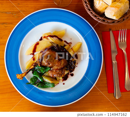 Duck confit in port with pear chutney 114947162