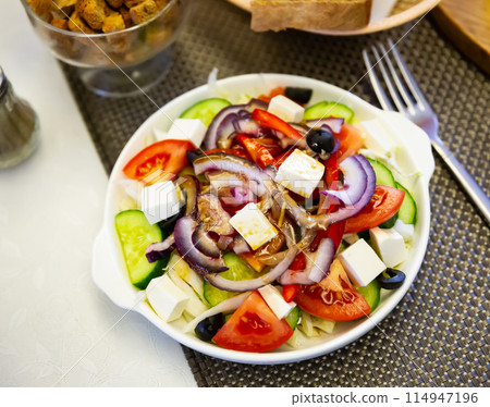 Fresh colorful Greek salad (horiatiki salad) with feta cheese 114947196