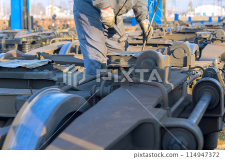 On railway junction, railway car wheelsets were waiting for repairs On railway junction, railway car wheelsets were waiting for repairs 114947372