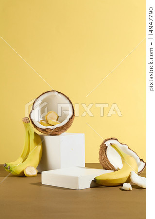 Minimalist scene with white color geometric podiums and tropical fruit composition for nature cosmetic, culinary or beverage product. Space for product presentation, frontal shot Minimalist scene with white color geometric podiums and tropical fruit composition for nature cosmetic, culinary or beverage product. Space for product presentation, frontal shot 114947790