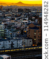 Sunset seen from a residential area 114948282