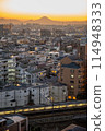 A city stained by the setting sun 114948333