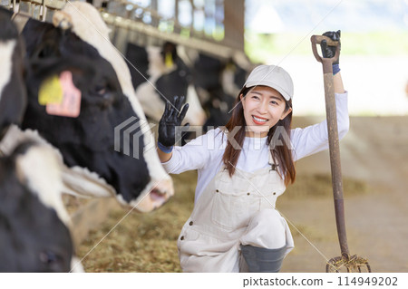 People working on the farm Dairy farmers 114949202