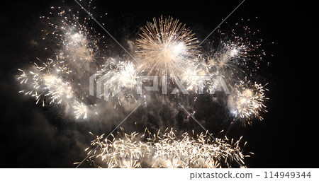 Golden Firework celebrate anniversary happy new year 2022, 4th of july holiday festival. Gold firework in the night time celebrate national holiday. Countdown to new year 2022 gold party time event 114949344