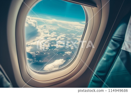 Airplane wing through aircraft window view 114949686