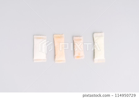 Assorted sachets of non-smoking tobacco product with different flavors on a light background Assorted sachets of non-smoking tobacco product with different flavors on a light background 114950729