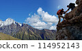 Asian hiking help each other on mountains 114952143