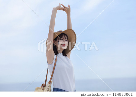 Young woman walking on the seaside Young woman walking on the seaside 114953001