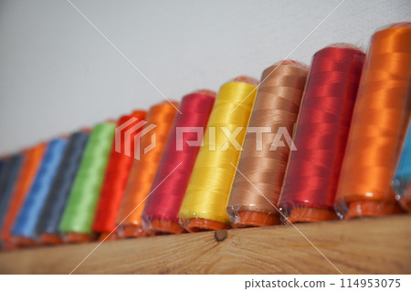 A lot of embroidery threads lined up A lot of embroidery threads lined up 114953075