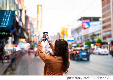 Young Asian tourists standing selfie taking a photo 114953472