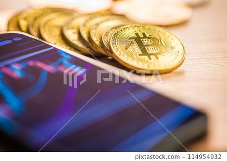 Bitcoin gold coin. Cryptocurrency and business chart in cellphone. Bitcoin gold coin. Cryptocurrency and business chart in cellphone. 114954932