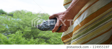 Male hand with big stone Male hand with big stone 114955197