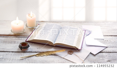 Bible on white wooden table 114955232