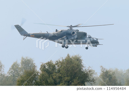 A low-flying Mi-24 Hind attack helicopter 114956484