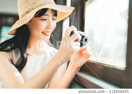 Woman traveling by train in summer 114956935
