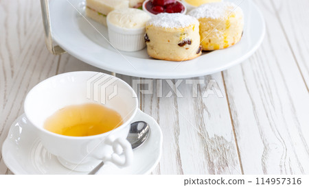 Afternoon tea stand with sweet treats, Afternoon tea set with dessert, High tea set with dessert. Afternoon tea stand with sweet treats, Afternoon tea set with dessert, High tea set with dessert. 114957316