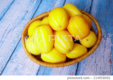 Korean melons on the wooden background Korean melons on the wooden background 114958092