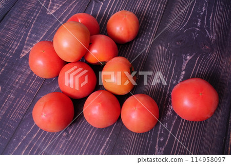 fresh red tomatoes on blue wooden background fresh red tomatoes on blue wooden background 114958097