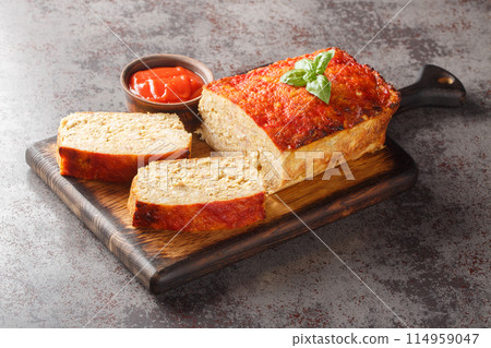 Healthy and comforting meal chicken meatloaf served with ketchup closeup on the wooden board. Horizontal 114959047