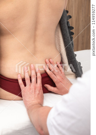 Female Patient Receiving Lower Back Osteopathic Therapy Female Patient Receiving Lower Back Osteopathic Therapy 114959277