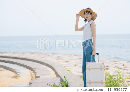 A woman who enjoys traveling alone 114959377