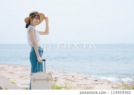 A woman who enjoys traveling alone 114959382