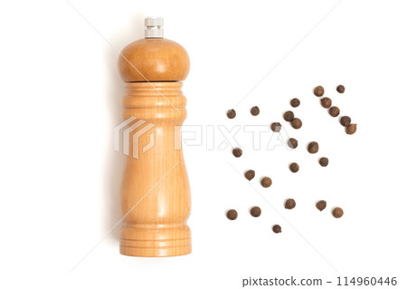 Wooden pepper mill on a white background. Cooking concept, top view Wooden pepper mill on a white background. Cooking concept, top view 114960446