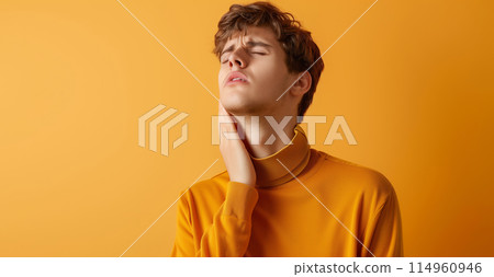 Unhappy man suffers from toothache, pain in teeth, dental, oral health, patient touches his cheek 114960946