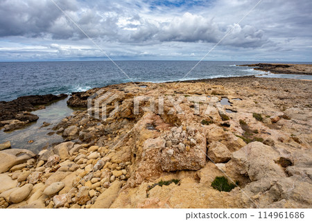 Qawra Point Beach with turquoise waters nearby. Malta 114961686