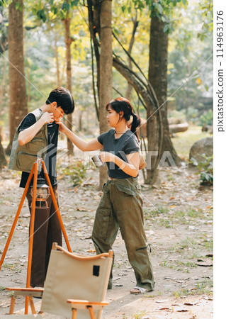 Asian couple sweet in tent inside on they camping trip, traveller relax and sleep togather in out door and camping trip Asian couple sweet in tent inside on they camping trip, traveller relax and sleep togather in out door and camping trip 114963176