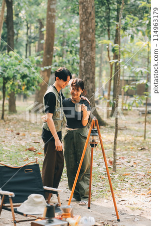 Asian couple sweet in tent inside on they camping trip, traveller relax and sleep togather in out door and camping trip Asian couple sweet in tent inside on they camping trip, traveller relax and sleep togather in out door and camping trip 114963179