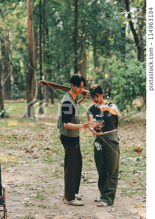 Asian couple sweet in tent inside on they camping trip, traveller relax and sleep togather in out door and camping trip 114963184