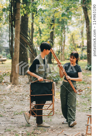 Asian couple sweet in tent inside on they camping trip, traveller relax and sleep togather in out door and camping trip Asian couple sweet in tent inside on they camping trip, traveller relax and sleep togather in out door and camping trip 114963190