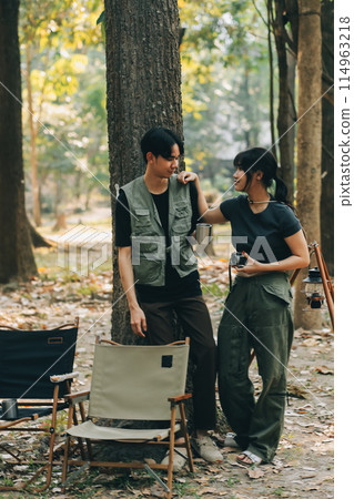 Asian couple sweet in tent inside on they camping trip, traveller relax and sleep togather in out door and camping trip 114963218