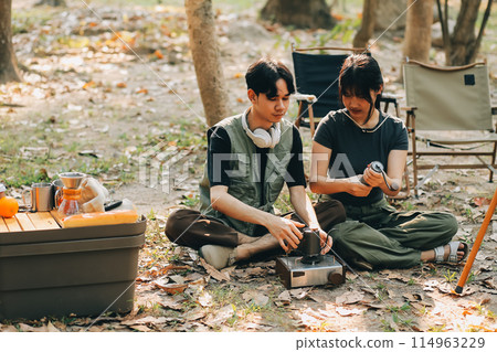Asian couple sweet in tent inside on they camping trip, traveller relax and sleep togather in out door and camping trip Asian couple sweet in tent inside on they camping trip, traveller relax and sleep togather in out door and camping trip 114963229