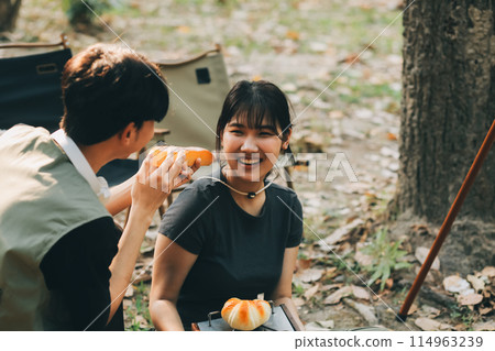 Asian couple sweet in tent inside on they camping trip, traveller relax and sleep togather in out door and camping trip 114963239