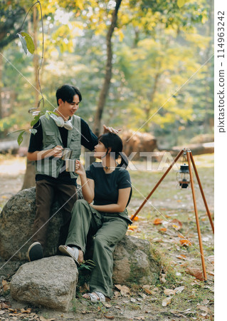 Asian couple sweet in tent inside on they camping trip, traveller relax and sleep togather in out door and camping trip Asian couple sweet in tent inside on they camping trip, traveller relax and sleep togather in out door and camping trip 114963242