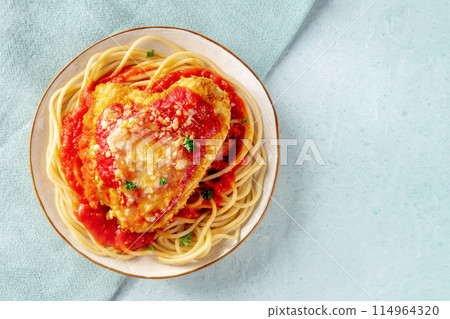 Chicken Parmesan, Italian pasta dish. Breaded chicken breast with cheese 114964320