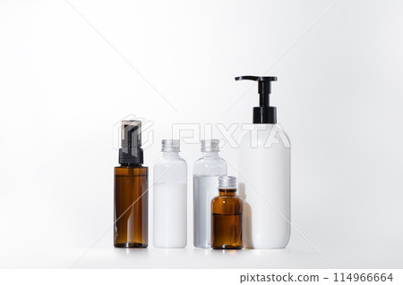 An array of practical cosmetic bottles, including sprays, pumps, light-proof bottles and plastic bottles 114966664